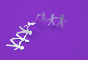 Paper cut chain of people on purple background
