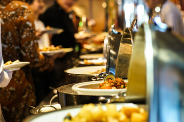 People hand grab buffet food serve in hotel restaurant