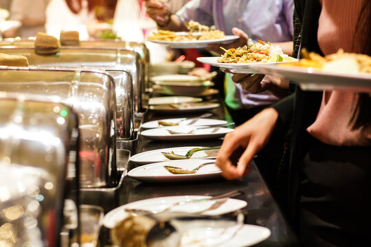 People Hand Grab Buffet Food Serve In Hotel Restaurant