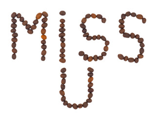Miss U written with coffee beans isolated on white background