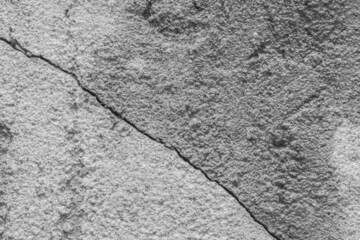 Obraz premium Crack on old dirty white concrete wall cement surface broken background damage texture