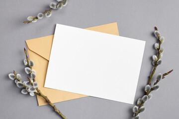 Greeting or invitation card mockup with envelope and willow twigs