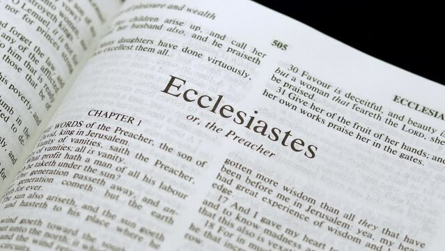 Close Up Shot of  Bible Page Turning to the book of Ecclesiastes