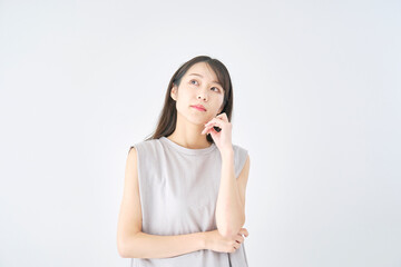 Fototapeta premium 女性 考える 白背景