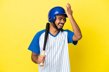 Young Colombian latin man playing baseball isolated on yellow background has realized something and intending the solution