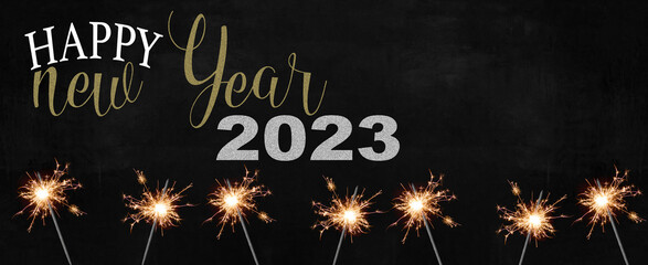 Happy new Year 2023 - Holiday New Year's Eve Silvester Party festive background banner greeting card - Many burning sparkler in the dark black night and lettering