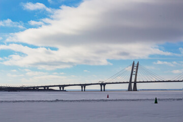 Modern bridge over the river in the urban city in winter 
