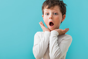 Amazed boy in light studio