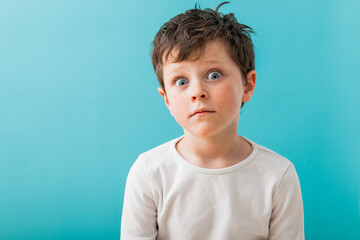 Amazed boy in light studio