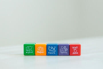 Colored cubes with different words. The process of success. Well done very good. nice work. super....