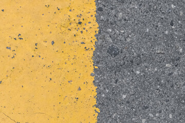 Asphalt street road markings with yellow paint abstract background design pattern