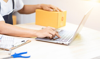 Small business Worker delivery service and working packing box, business owner working checking...