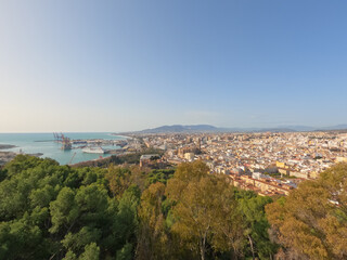 Fototapeta na wymiar Gibralfaro and Alcazaba ramparts overlooking Malaga city and the Mediterranean Sea, Spain, Europe