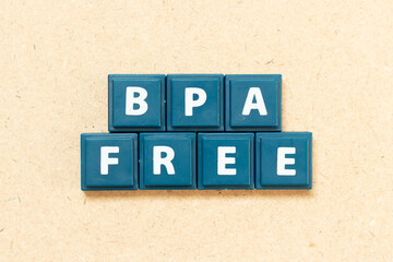 Tile alphabet letter in word BPA (Bisphenol A) free on wood background