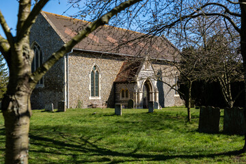 Fototapeta na wymiar All Saints church in the small village of Sutton in the rural British countryside