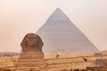 View of Sphinx in The Giza Plateau with The Great Pyramid of Giza in the background.