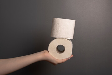 hand holding toilet paper