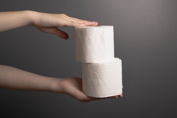 hands holding toilet paper