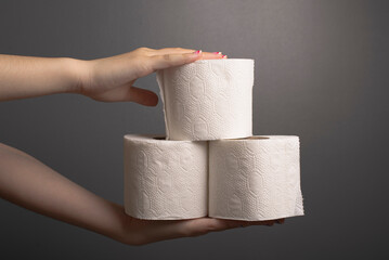 hands holding toilet paper