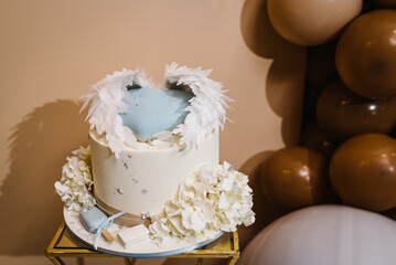 Birthday Cake on a background balloons party decor. Baby shower party, decor. Celebration baptism concept. Copy space. Celebration concept. Trendy Cake. Delicious reception.