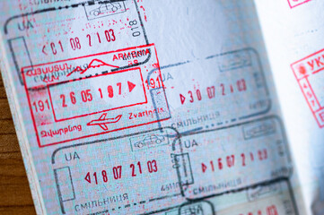 Immigration border stamps from Armenia and Ukraine in the passport.