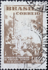 Brazil - circa 1951: a postage stamp from Brazil, showing a cross with pilgrims as a symbol for The First Mass in Brazil (1861), by Victor Meirelles .