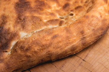 Close-up of fresh appetizing pita bread. delicious baked food