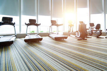 Modern gym with many treadmills