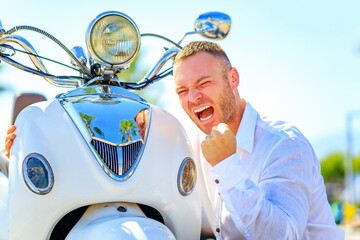 Fashion man with scooter in helmet in paradise tropics © yurakrasil