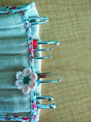 Top view, various knitting needles Creative knitting hobby background with text space.