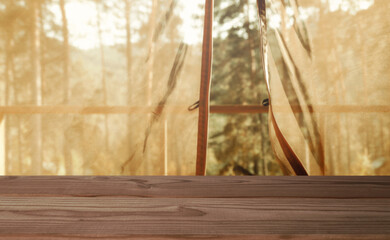wooden table on the blur background of open window