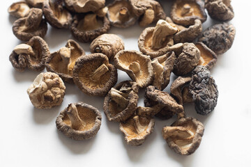 dried shiitake mushrooms close-up on a white background