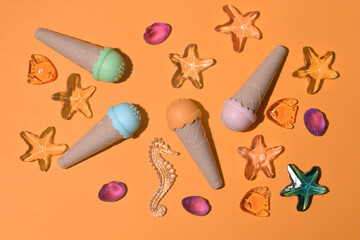 toy ice cream of different colors on a colored background  