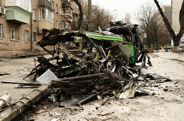 The trolleybus was destroyed on the street after Russian shelling. consequences of the war in Ukraine. broken transport.