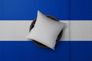 Patriotic pillow mock up on background in colors of national flag. Honduras