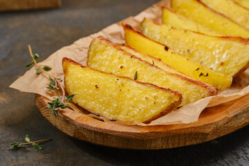 Potato wedges fries chips with thyme. Shallow depth of field