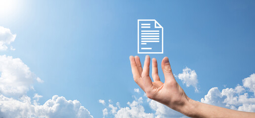 Male hand holding a document icon on blue background. Document Management Data System Business Internet Technology Concept. Corporate data management system DMS