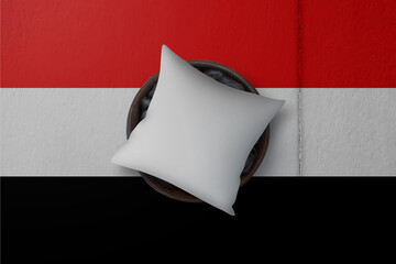 Patriotic pillow mock up on background in colors of national flag. Yemen