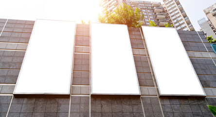 Blank billboard on the wall of modern building
