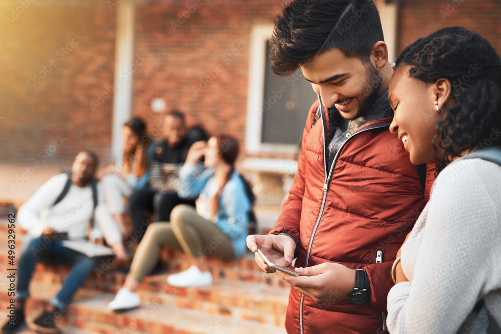 Poster navigating campus life with a mobile app. shot of a young man and woman using a mobile phone togethe