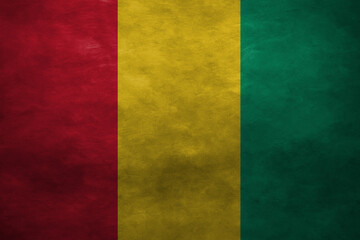 Patriotic stone wall background in colors of national flag. Guinea