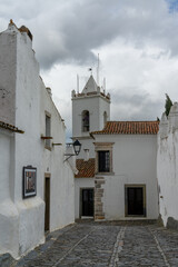 idyllic cobblestone street in the center of Monsaraz village with picturesque whitewashed houses
