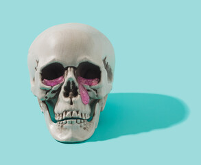 Fototapeta premium Human skull with pink goo tears falling from the eyes. Cyber sadness conceptual background.