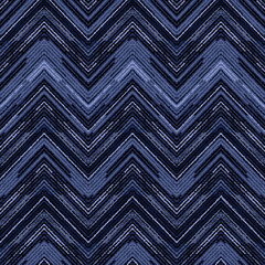 Seamless textured monochrome zigzag pattern. Blue background.