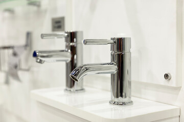 Samples of taps in the store. Large selection of plumbing. Construction, design and repair.