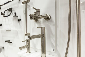 Samples of taps in the store. Large selection of plumbing. Construction, design and repair.