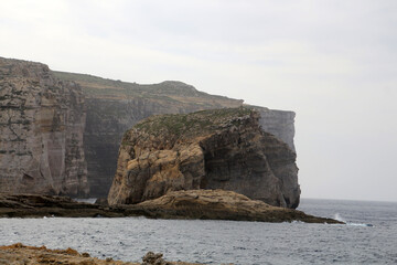Fungus Rock is a small island in the form of a large limestone block off the west of the island of Gozo, partially closing off Dwejra Bay
