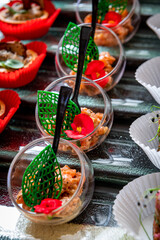 Various snacks, buffet table with different dishes.