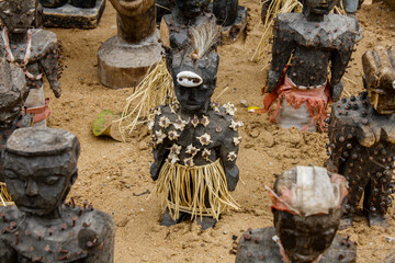 A voodoo doll part of an army of voodoo dolls on display at a fetish market