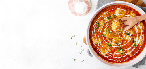 Web banner with Malai Kofta topped with yogurt and fresh herbs. Hot meal with potato and paneer...